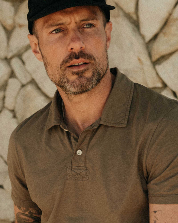 fit model posing in The Cotton Hemp Polo in Olive