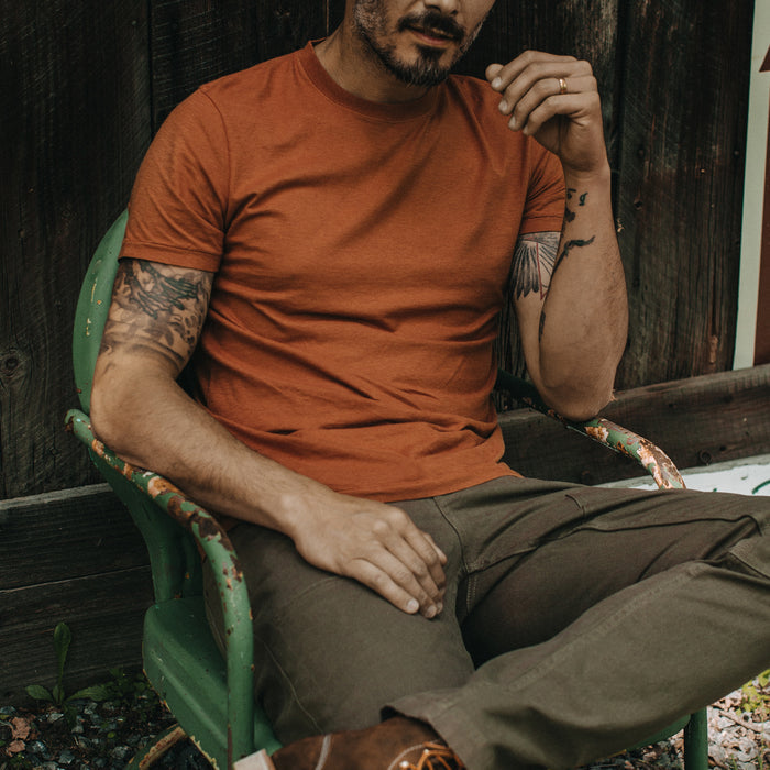 fit model sitting in The Cotton Hemp Tee in Copper
