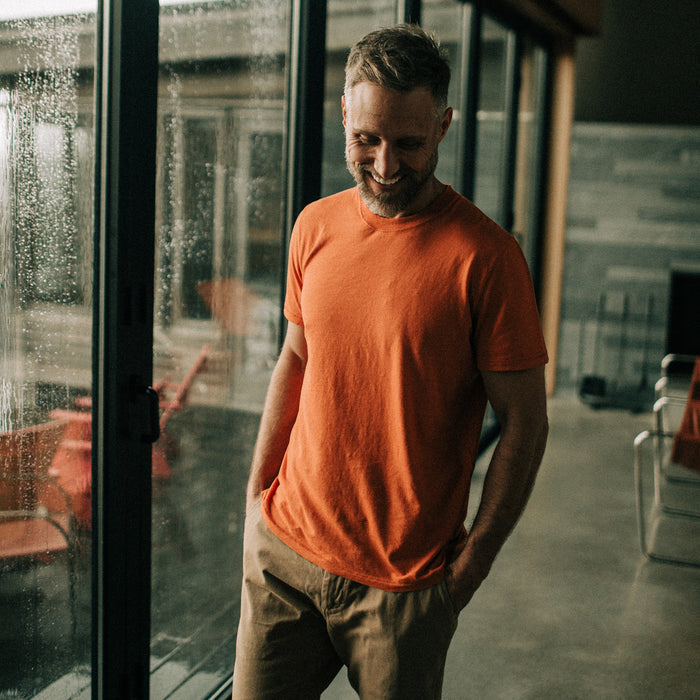 fit model smiling and walking in The Cotton Hemp Tee in Monarch