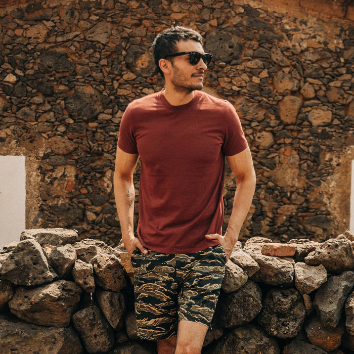 fit model wearing The Cotton Hemp Tee in Rust, hands in pockets