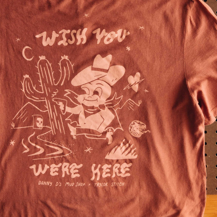 editorial image of the back graphic on The Cotton Hemp Tee in Wish You Were Here