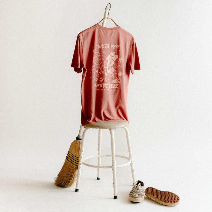 editorial image of The Cotton Hemp Tee in Wish You Were Here on a stool
