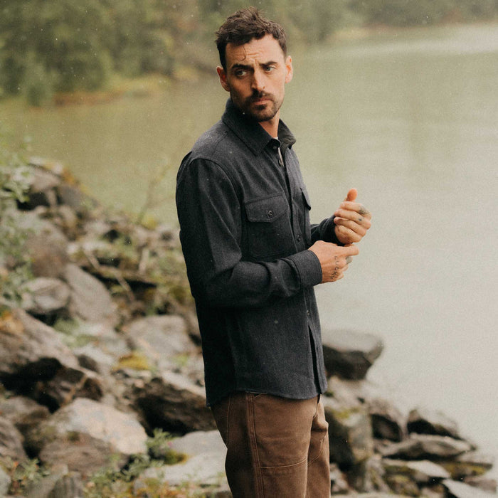 fit model adjusting the cuffs on The CPO Shirt in Marine Tweed Wool