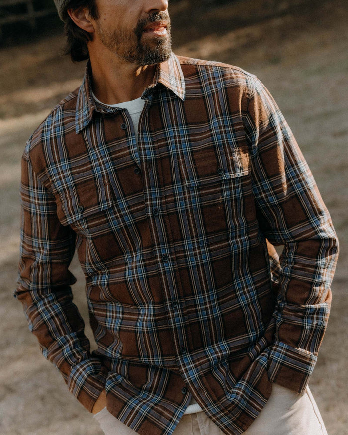 fit model posing in The Craftsman Shirt in Brick Plaid