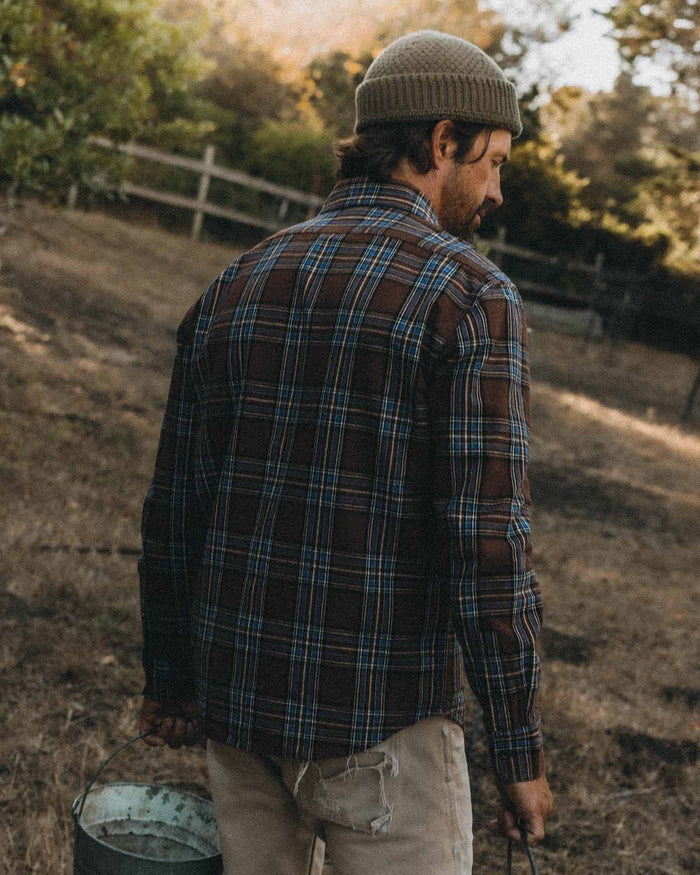 fit model showing off The Craftsman Shirt in Brick Plaid