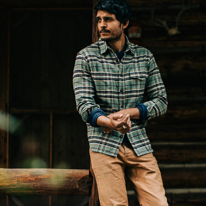 fit model wearing The Crater Shirt in Blue Plaid, looking ;eft