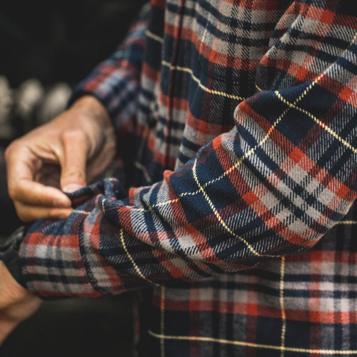 Fit model showing the cuff of the Crater Shirt in Burgundy Plaid