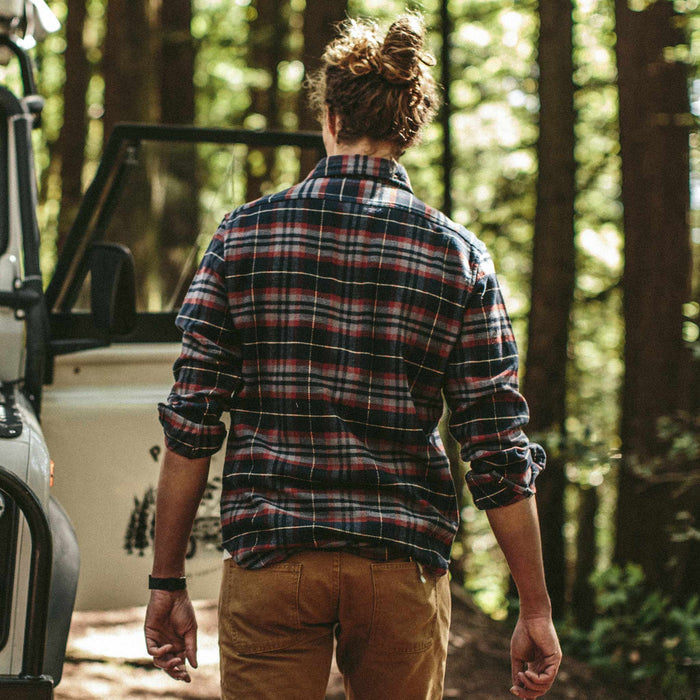 Fit model walking to his truck in the Crater Shirt in Burgundy Plaid