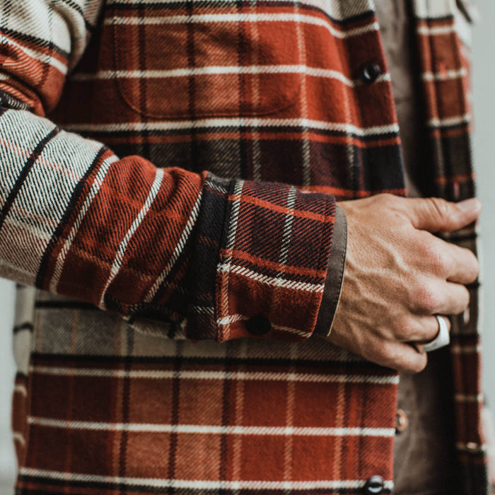 Our fit model wearing The Crater Shirt in Rust Plaid