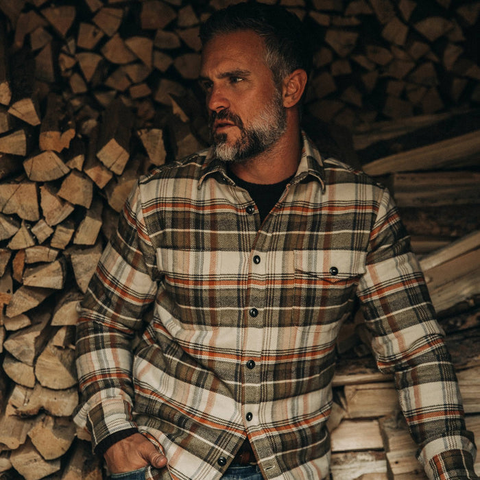 our fit model wearing The Crater Shirt in Tan Plaid—looking left
