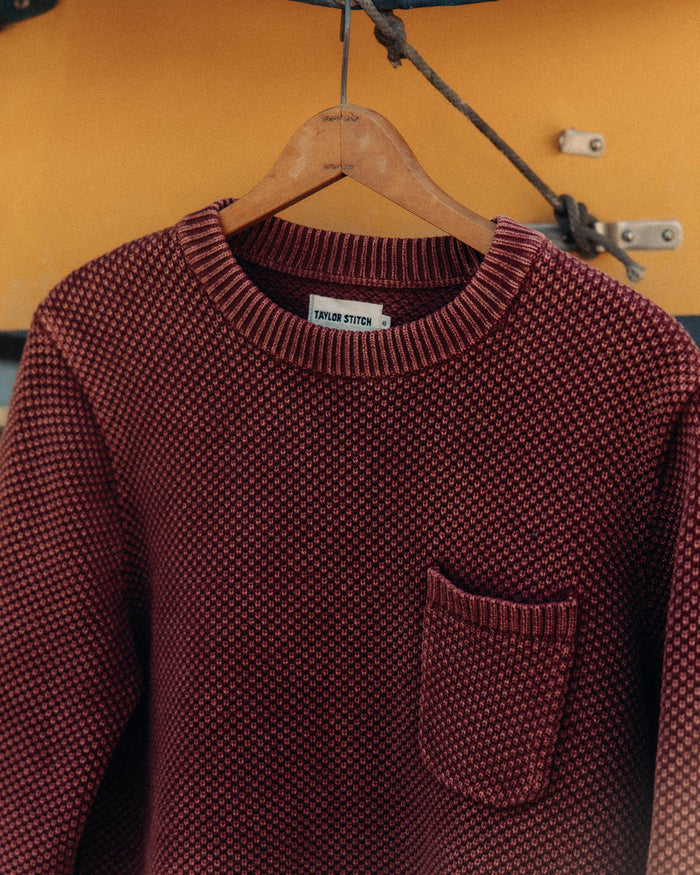 editorial image of The Crawford Crew Sweater in Dried Cherry hanging