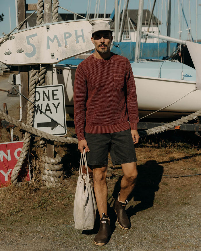 fit model showing off The Crawford Crew Sweater in Dried Cherry