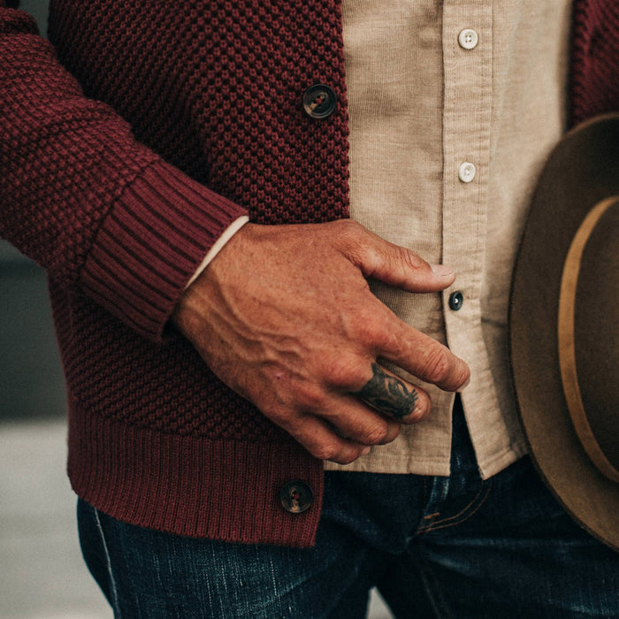 fit model wearing The Crawford Sweater, sleeve and button detail