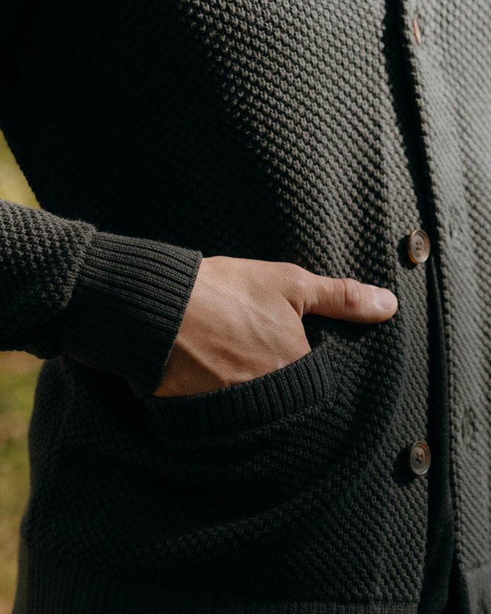 fit model walking in The Crawford Sweater in Charcoal