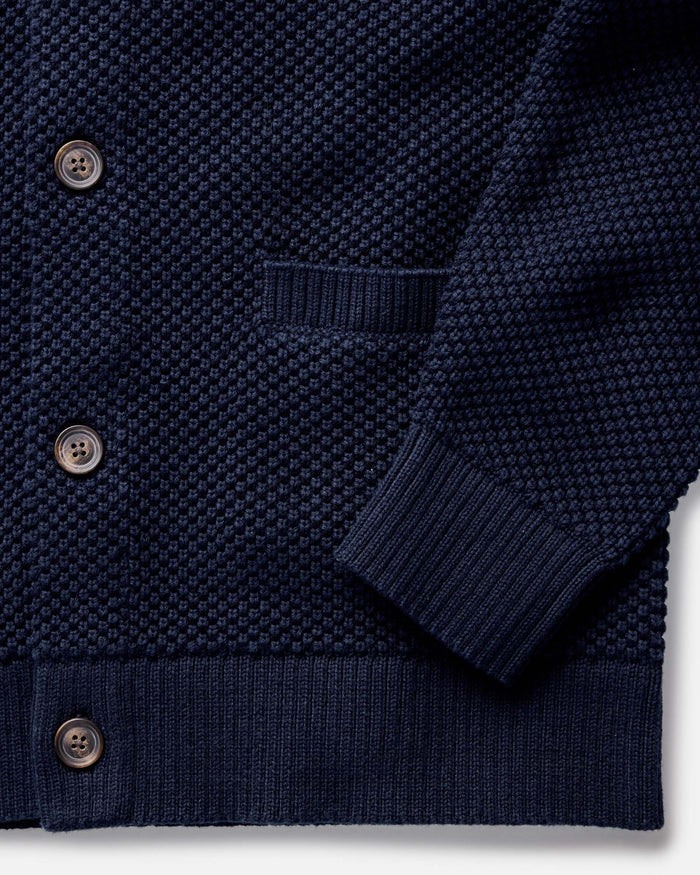 fit model rocking the The Crawford Sweater in Navy in a car