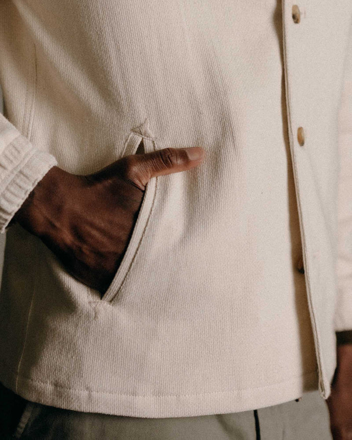 fit model with his hand in his pocket wearing The Crew Jacket in Seeded Natural Sashiko