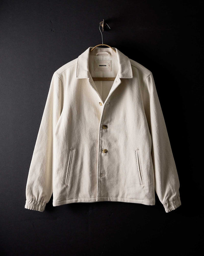 editorial image of The Crew Jacket in Seeded Natural Sashiko hanging