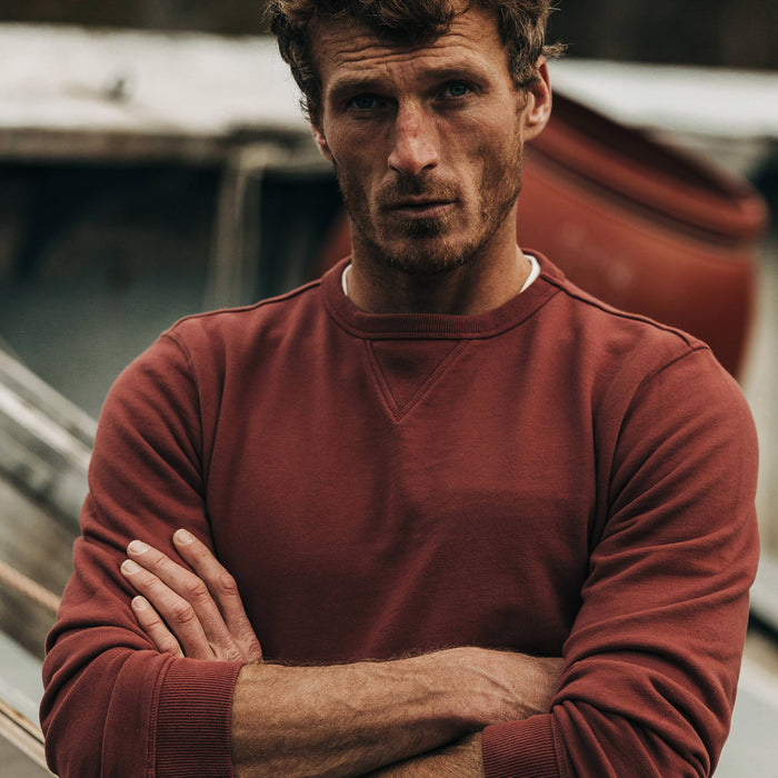 fit model wearing The Crewneck in Brick Red Terry, arms crossed
