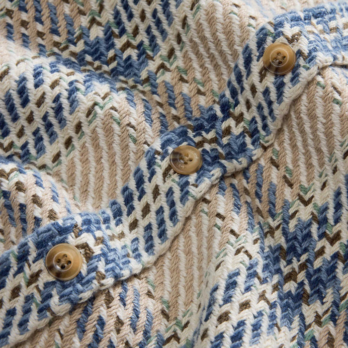 material shot of the buttons on The Cutter Overshirt in Sandbar Plaid
