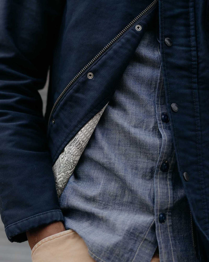 fit model showing off the inside of The Deck Jacket in Dark Navy Bedford Cord