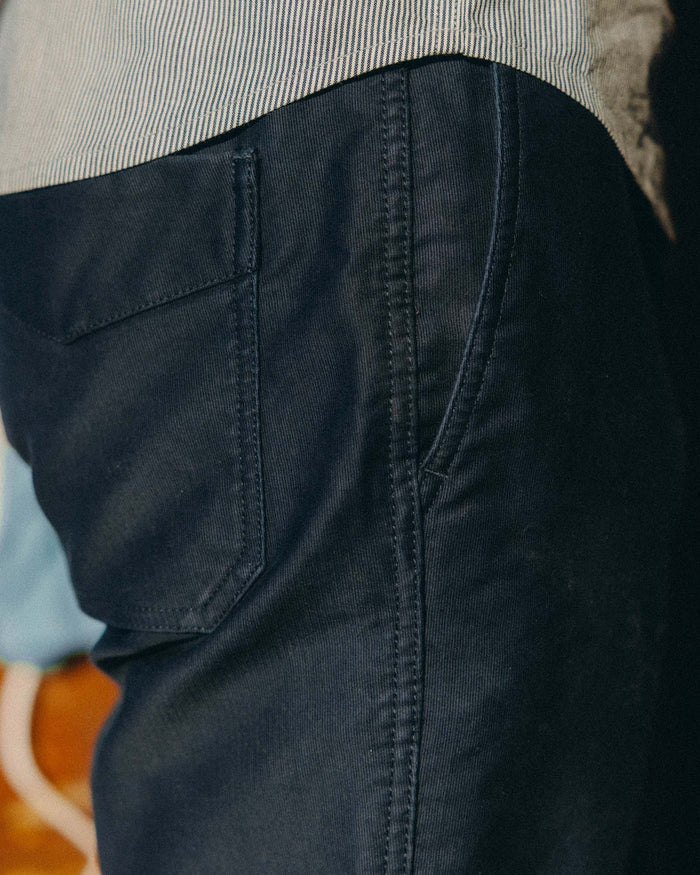 fit model showing off the sides of The Deck Pant in Dark Navy Bedford Cord
