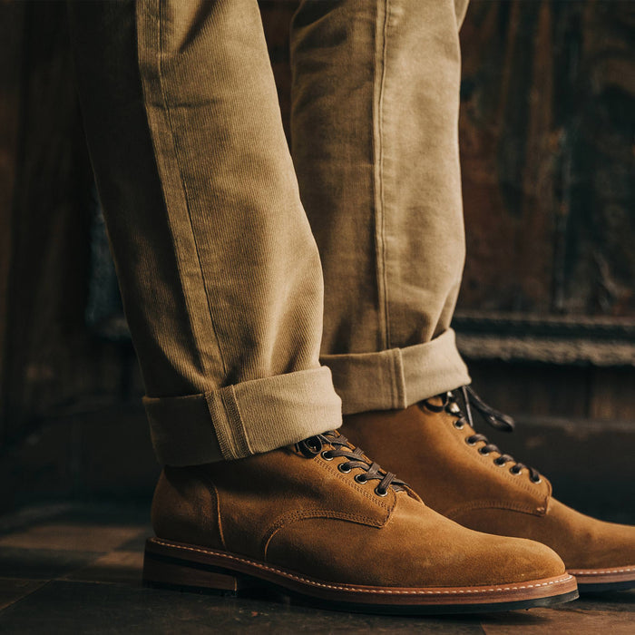 fit model wearing the all day pant, cuffed over boots