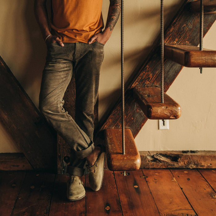 fit model wearing the all day pant, near stairs