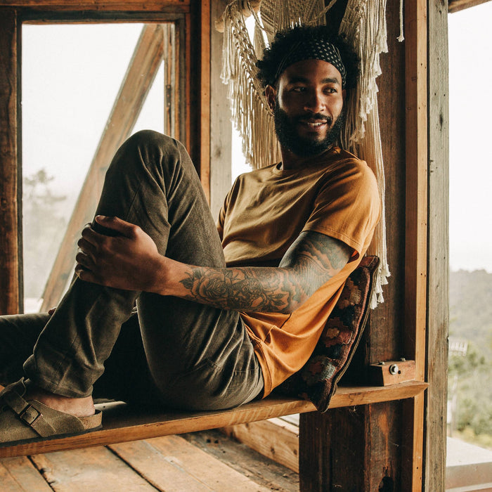 fit model wearing the all day pant, sitting