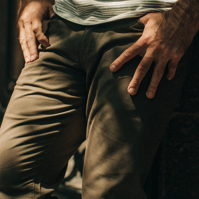 fit model wearing The Democratic All Day Pant in Olive Bedford Cord, cropped up close