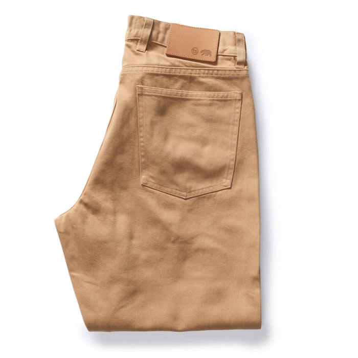 folded flatlay of the back of The Democratic All Day Pant in Tobacco Selvage Denim