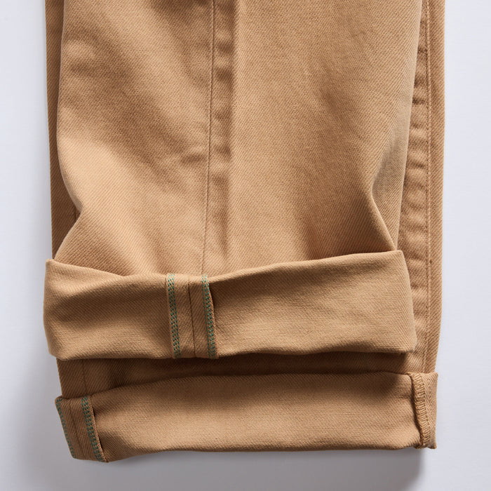 material shot of the selvage cuffs on The Democratic All Day Pant in Tobacco Selvage Denim