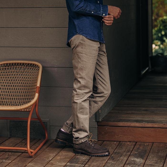 fit model showing the side view of The Democratic All Day Pant in Washed Walnut Selvage