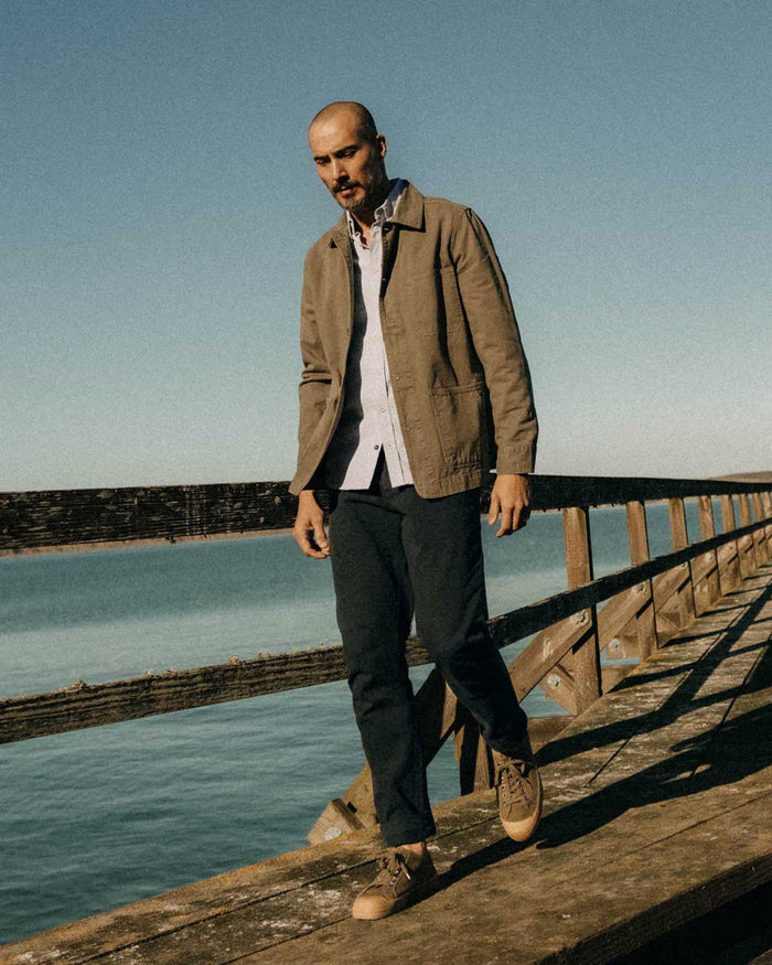 fit model posing in The Democratic Foundation Pant in Organic Navy