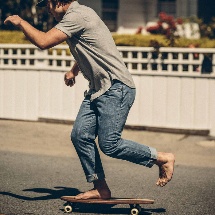 Our fit model skateboarding in his jeans