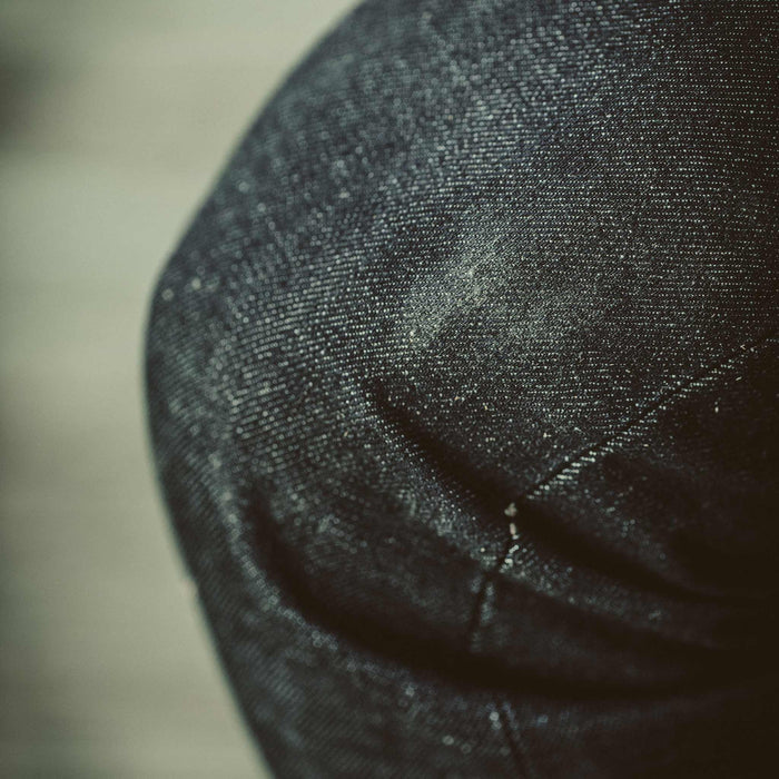 Fit model showing a close up of the Era Cone Mills denim