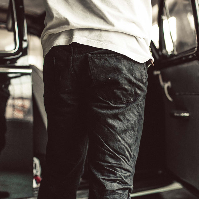 Our fit model wearing The Democratic Jean in Kuroki Mills Black Selvage.