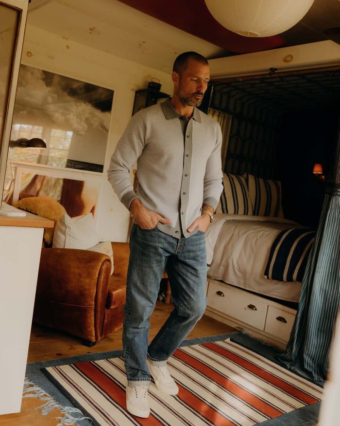 fit model showing off bottom hem on The Democratic Jean in Mid Wash Organic Selvedge