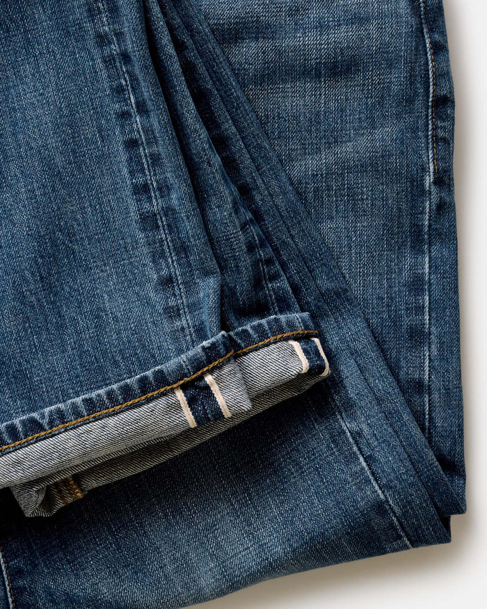 fit model posing in The Democratic Jean in Mid Wash Organic Selvedge