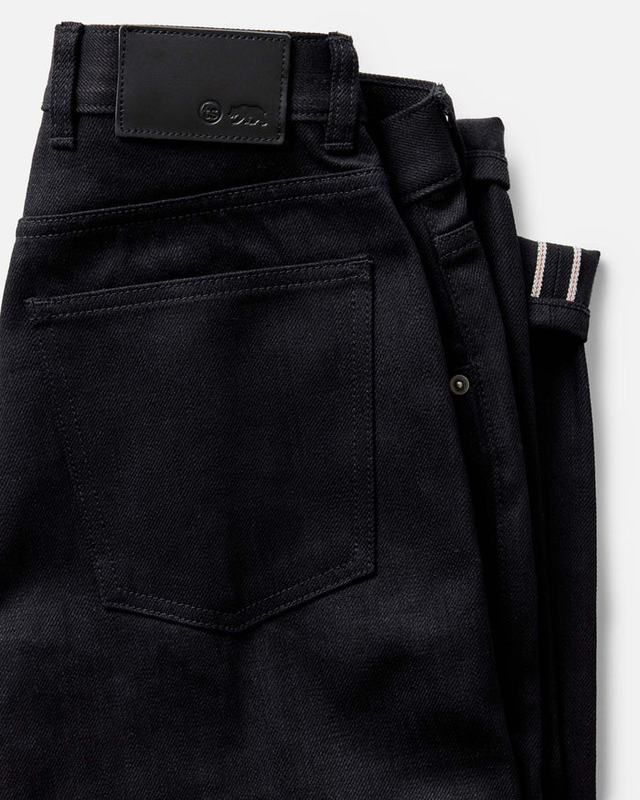 folded flatlay of the back of The Democratic Jean in Rigid Black Organic Selvedge