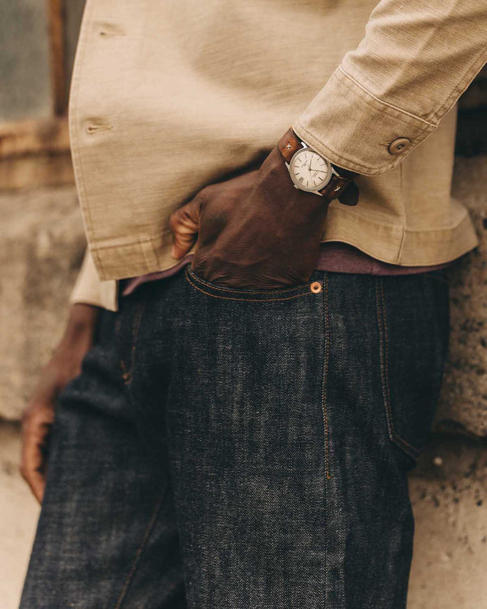 fit model walking wearing The Democratic Jean in Rigid Organic Selvedge