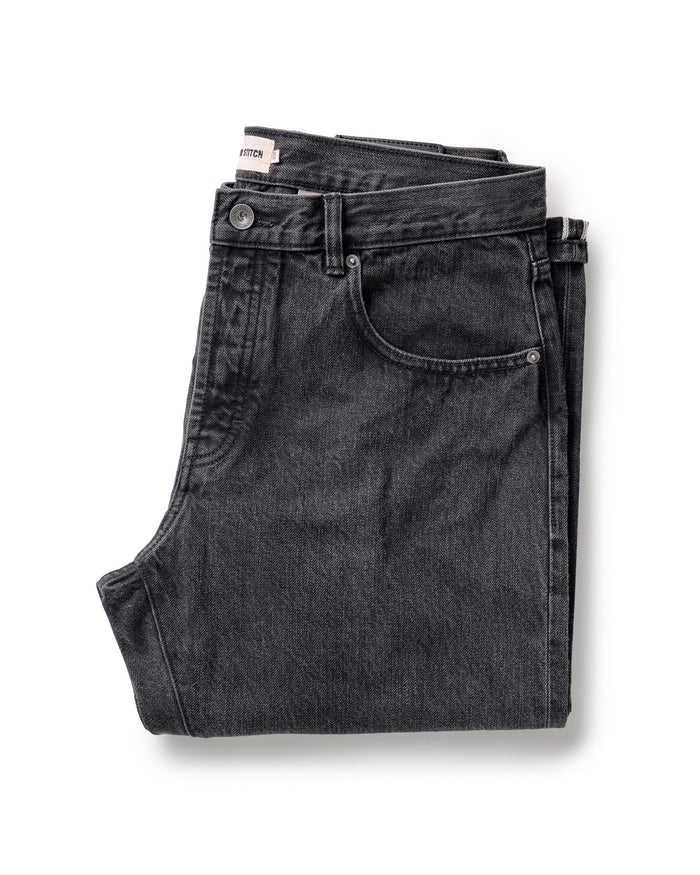 folded flatlay of The Democratic Jean in Washed Black Organic Slub Selvedge