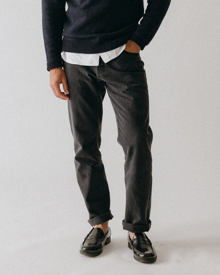fit model posing in The Democratic Jean in Washed Black Organic Slub Selvedge