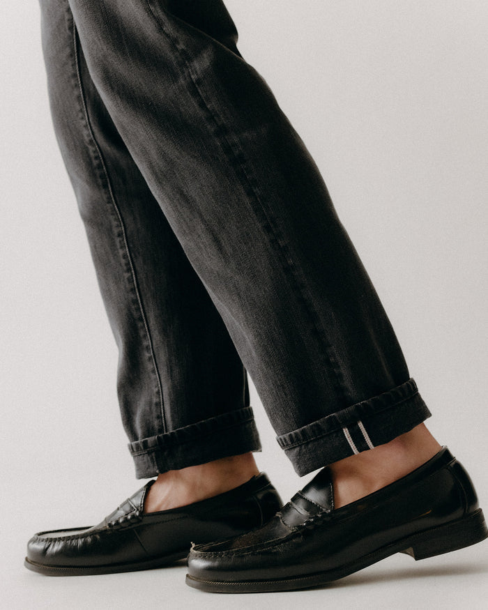 fit model showing off the cuffs on The Democratic Jean in Washed Black Organic Slub Selvedge