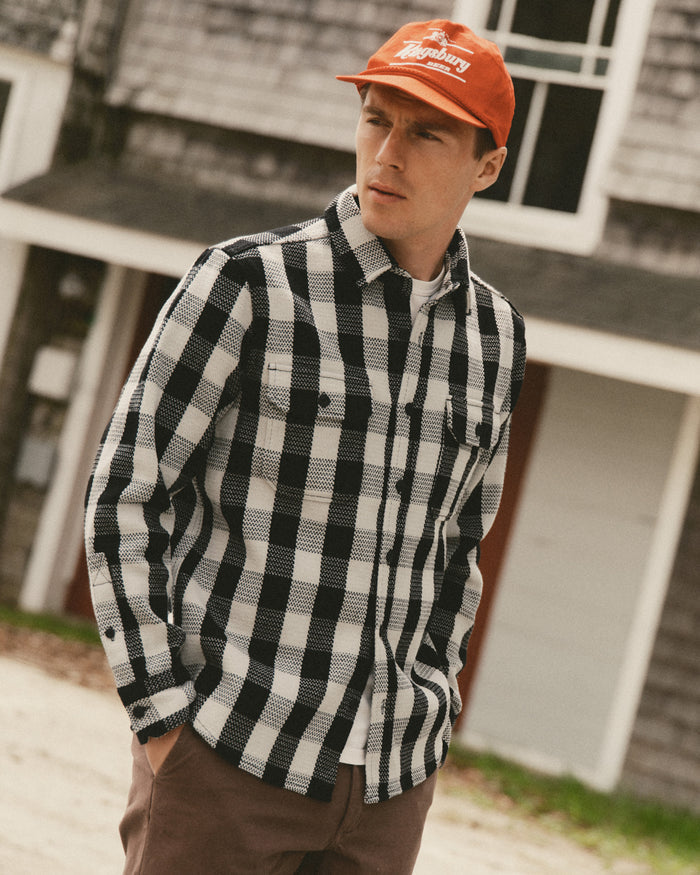 fit model posing in The Division Shirt in Black Indigo Check