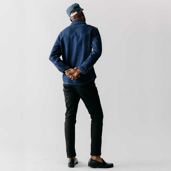 editorial image of The Division Shirt in Indigo Twill on a plant