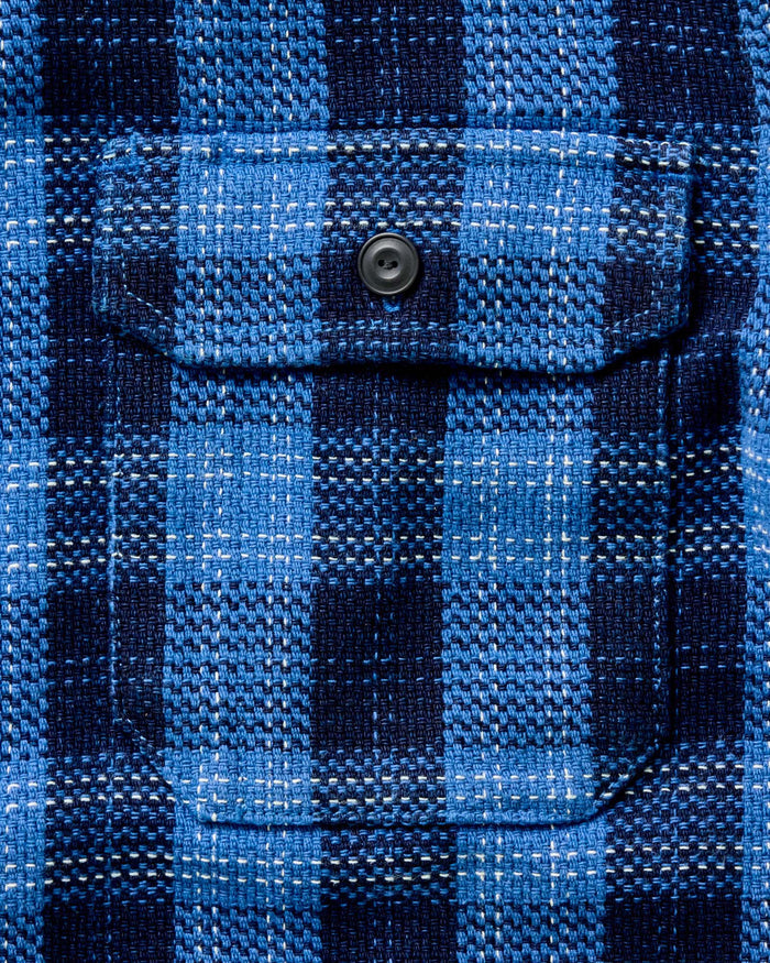 material shot of the buttons on The Division Shirt in Rinsed Indigo Plaid