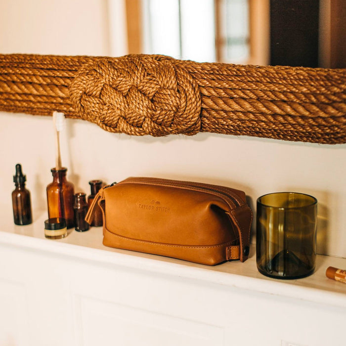 textural material shot of The Dopp Kit in Saddle Tan in bathroom