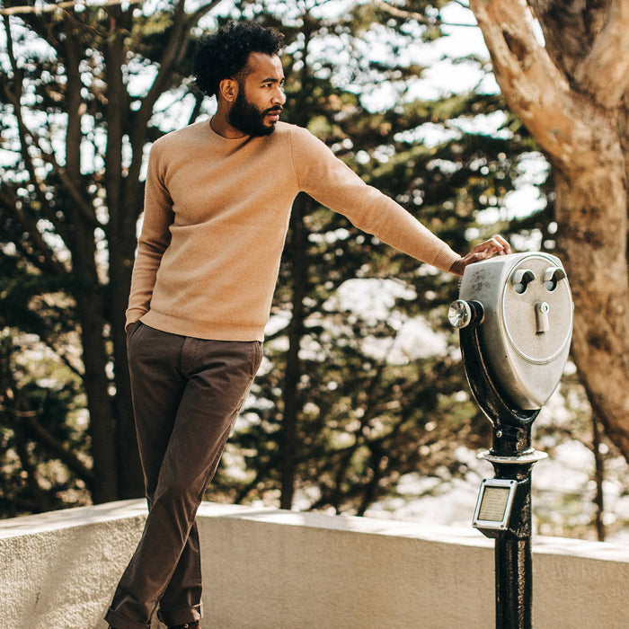 fit model wearing The Double Knit Sweater in British Khaki, next to lookout point