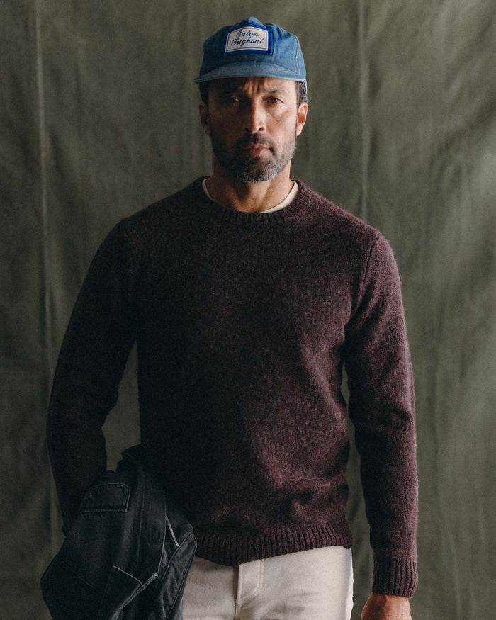 fit model posing in The Eastmoor Sweater in Heather Port Wool