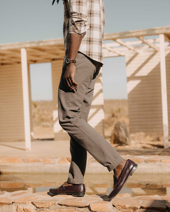 fit model walking wearing The Easy Pant in Canteen Seersucker